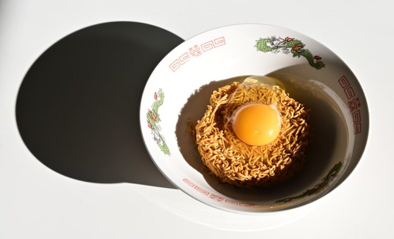 An egg in a bowl on a table