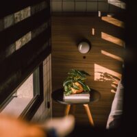 a small table with a potted plant on top of it