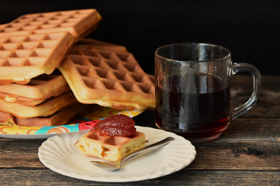 A stack of waffles sitting on top of a white plate